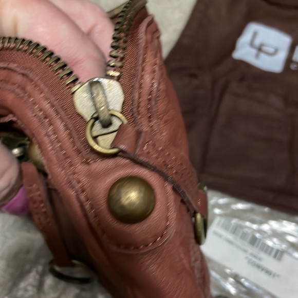 New, LINEA PELLE leather wristlet. Inside zip pocket, front zip, and top zip. - Picture 5 of 7